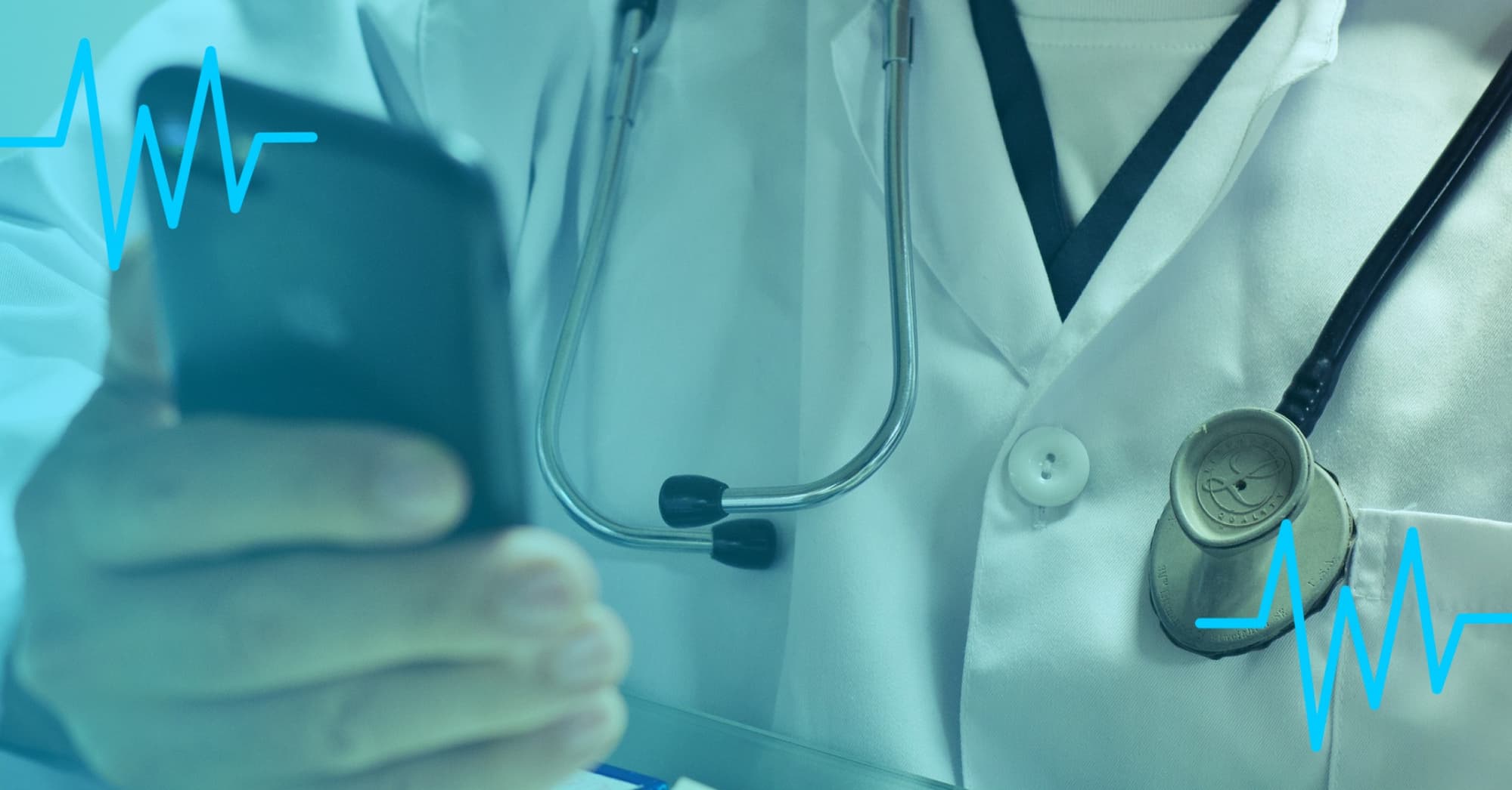 A hand of a doctor holding a smartphone with a stethoscope in the background